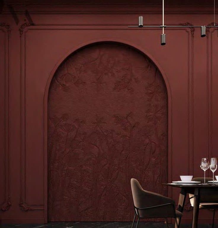 Arched burgundy dining nook at LYDYA